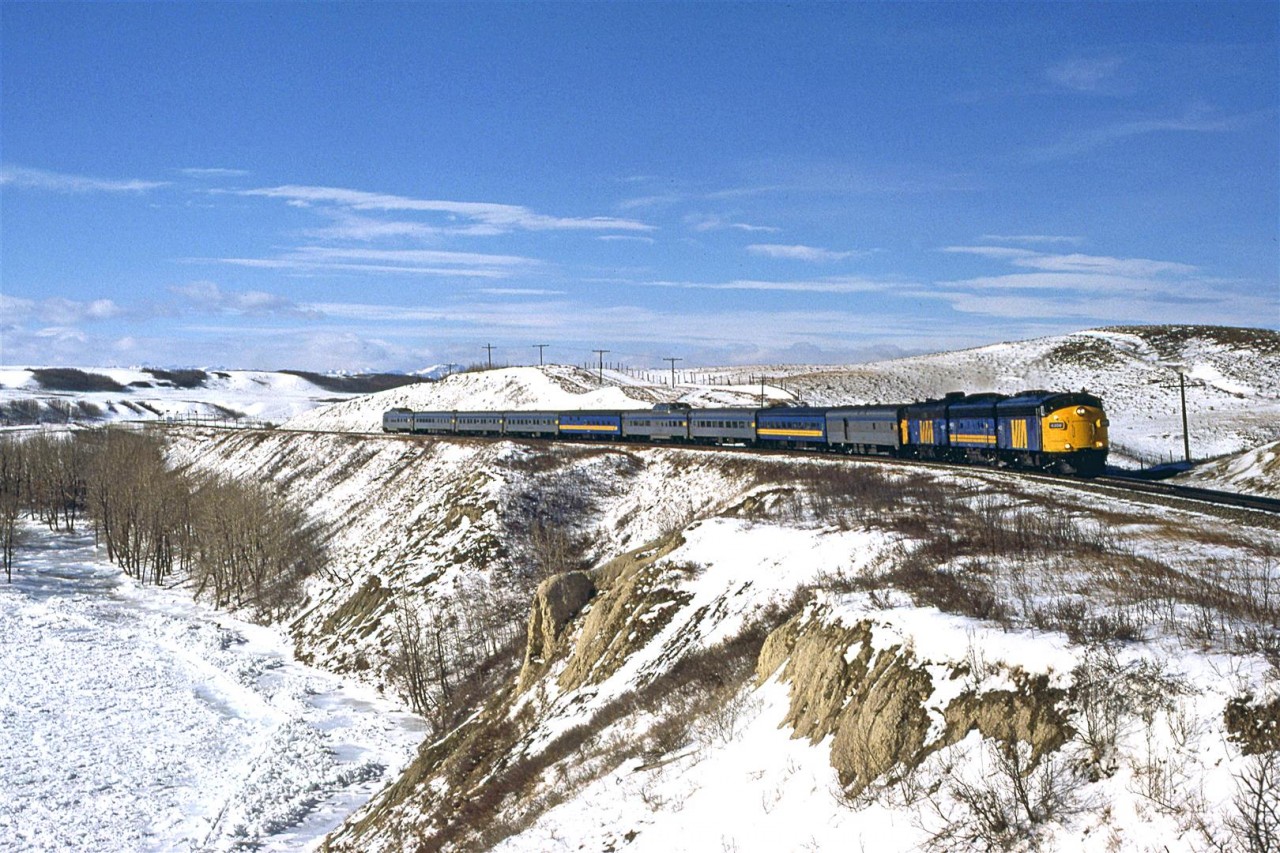 The eastbound "Canadian" travels along the frozen Bow River between Cochrane and Calgary.