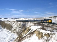 The eastbound "Canadian" travels along the frozen Bow River between Cochrane and Calgary.