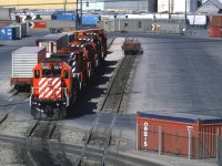 This was CP's intermodal yard in Calgary in 1986. The photo was taken from the north side of the Blackfoot Trail bridge. I am not sure what is there not. Streets View shows a lot of vehicles parked there.