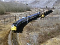 A better view of Mitford siding is had by this elevated view. The abandoned coal mines would have been located in that heavily wooded slope on the left, maybe as far wast as the conifers.
Mitford is also a junction with the Copithorn Spur, an 8.9 mile steep and twisted piece of railroad that leads to a sulphur plant. I suppose that there were unit train that would load there but I never saw one, nor did I have a radio to get the heads-up as when I might try to catch one. Bing Maps has a detailed photo of the facility, and currently (2016), it looks like they are shipping liquid products, perhaps sulphur and LPG?
