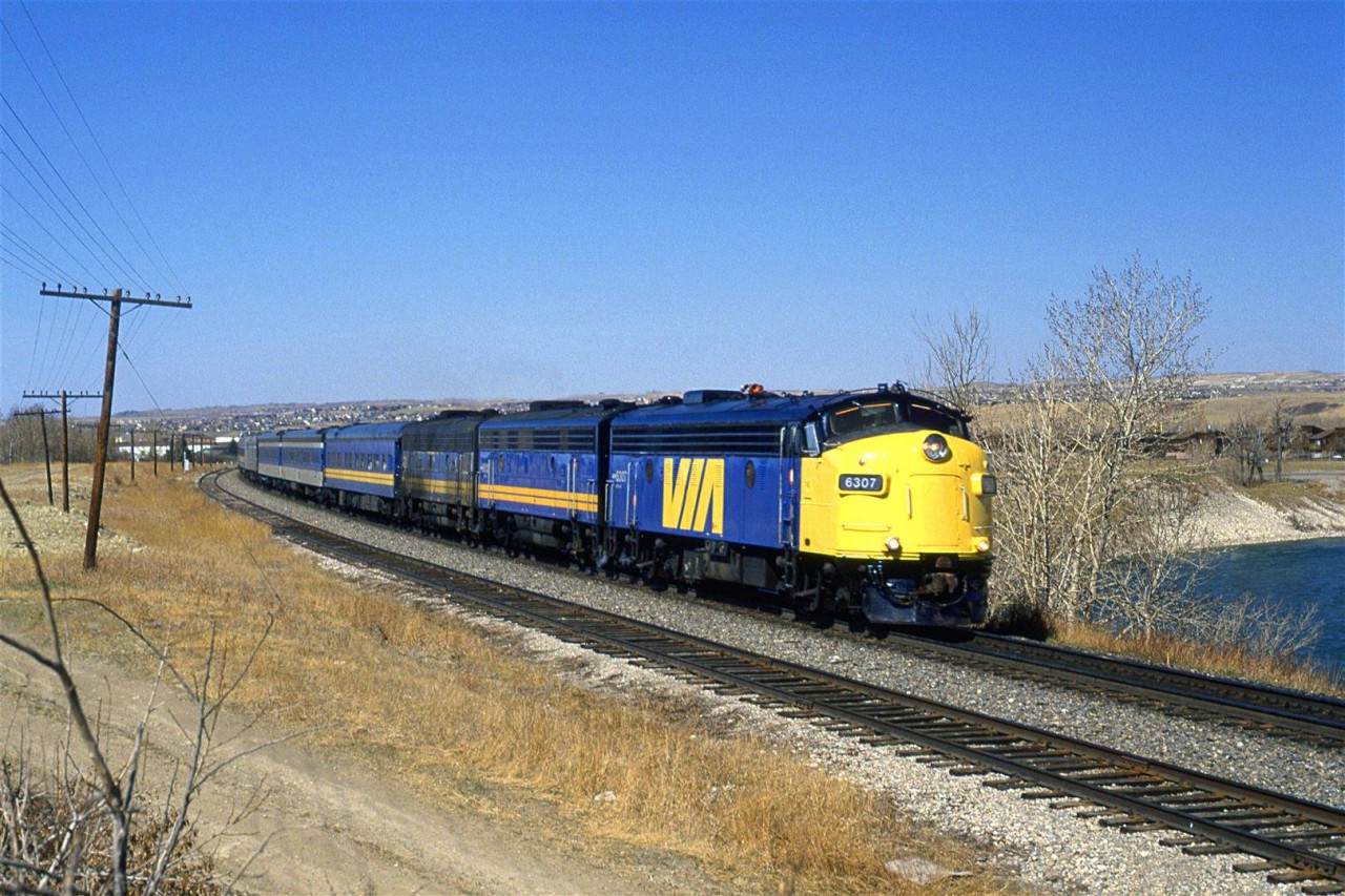 The first two units on this eastbound "Canadian" show a little pride of ownership. The third unit, however, looks like it had been dragged through a tarpit.
I am not too sure what the story is on the 2nd and 3rd cars, though. This is definitely not standard VIA paint.