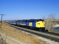The first two units on this eastbound "Canadian" show a little pride of ownership. The third unit, however, looks like it had been dragged through a tarpit.
I am not too sure what the story is on the 2nd and 3rd cars, though. This is definitely not standard VIA paint.