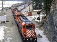 Immediately after the SPENO rail-grinder cleared (seen on siding), this westbound grain train received clearance and left Field yard.