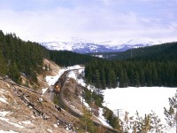 At the west end of Stephen Siding, technically in the province of British Columbia. My notes are not clear, but I think that the train is proceeding east, because I have a photo of a westbound grain train taken shortly afterward. Also, the rail grinder was previously eastbound out of Field. It probably went into Stephen siding to clear the westbound grain - but I am not certain. I have a slight recollection of this being a strange movement.