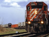 Another shot on Edworthy Park. An eastbound intermodal cautiously works through the work limits of a rail replacement crew.