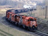 The outbound Exshaw Turn is approaching Kieth yard. Perhaps that is where the box cars will be dropped? The aggregate cars are likely headed to Exshaw to be loaded, and the tank cars might be going to the Copithorn Spur for liquid sulphur loading. I wish that I had paid attention to what was in those tank cars.
It's May 9 and the grasses are starting to show a touch of greening.