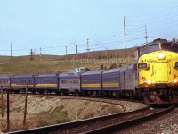 A rather beat up FP9-A lead this day's eastbound "Canadian" as it approaches the Bow River crossing in west Calgary.