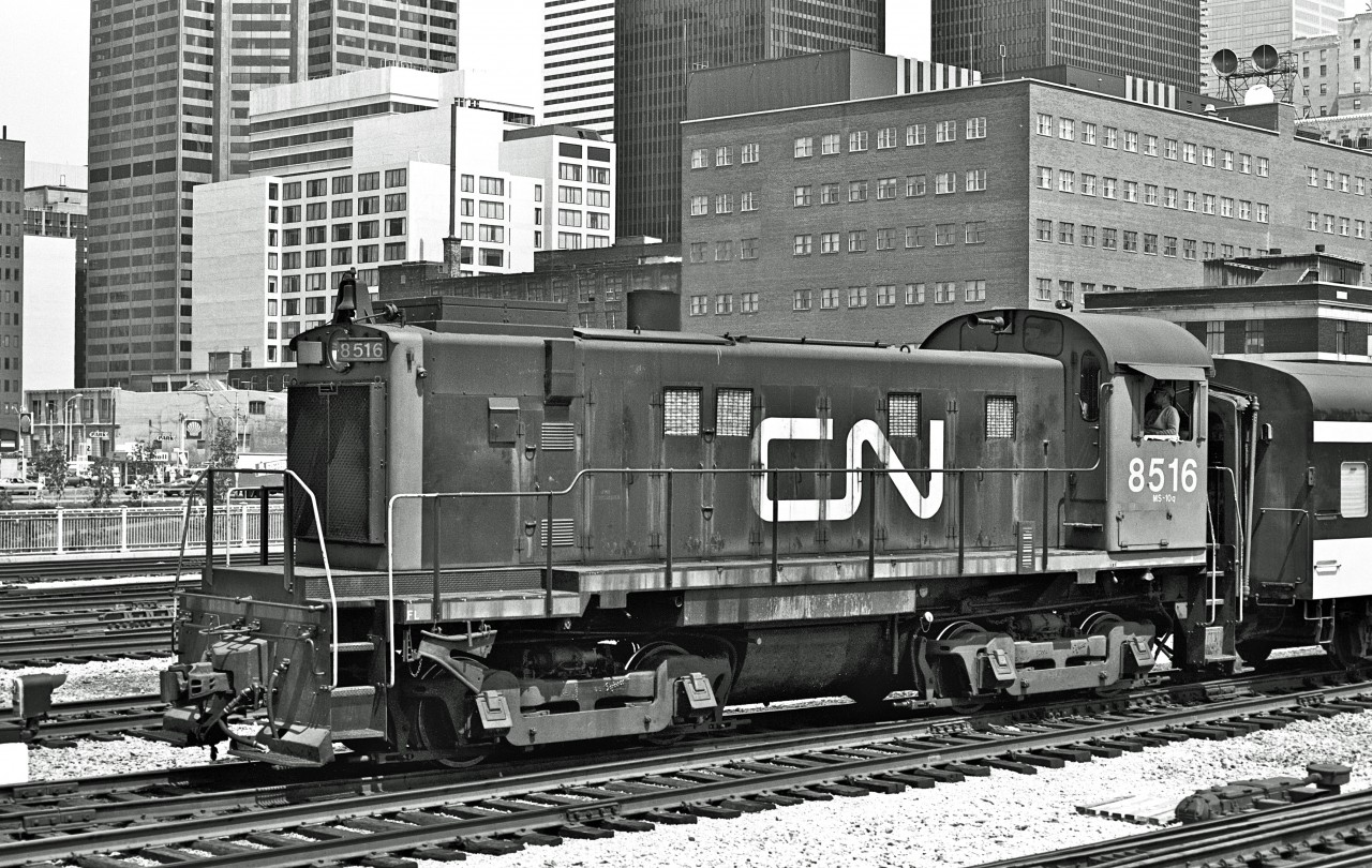 Built in July '58, MLW S13u #8516 approaches Union Station.  Circa 1975.