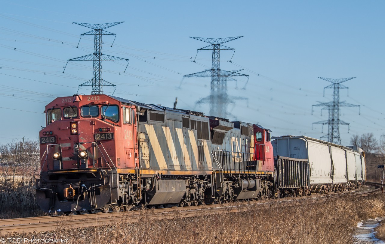 On a very cold morning, a pair of Dash 8s lead CN 373 through Bowmanville on the Kingston Sub, bound for Toronto.

Not a bad way to start 2016 :)


CN 2413 C40-8M, CN 2148 C40-8W