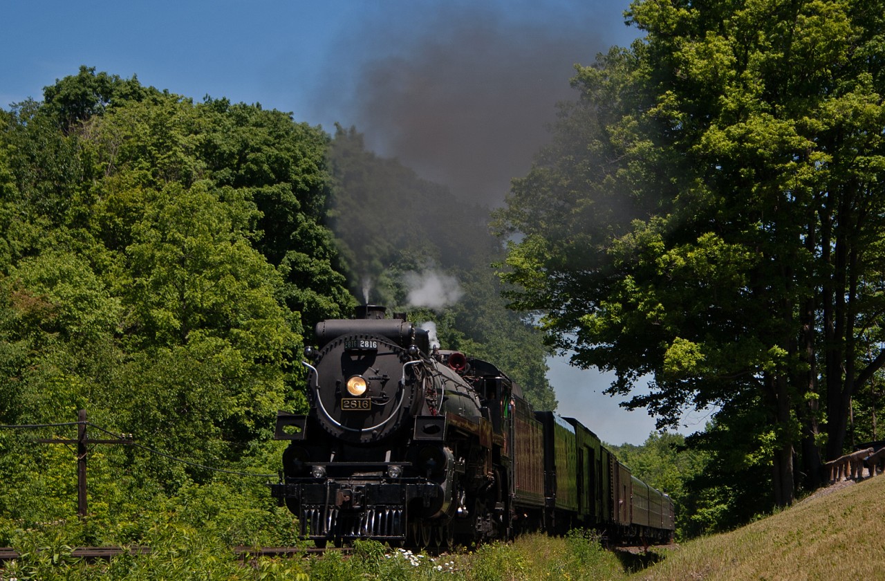 CP 2816 thunders up the Niagara Escarpment with an excursion train in tow. The train originated in Toronto, with the 2816 and CP Business cars lashed up with a 10 car GO train with an F59PH on the tail end.  At Milton, the GO equipment was left behind and the 2816 took off for the Hamilton Sub before heading south to Hamilton and on wards to Welland for the night before traveling west through the USA.