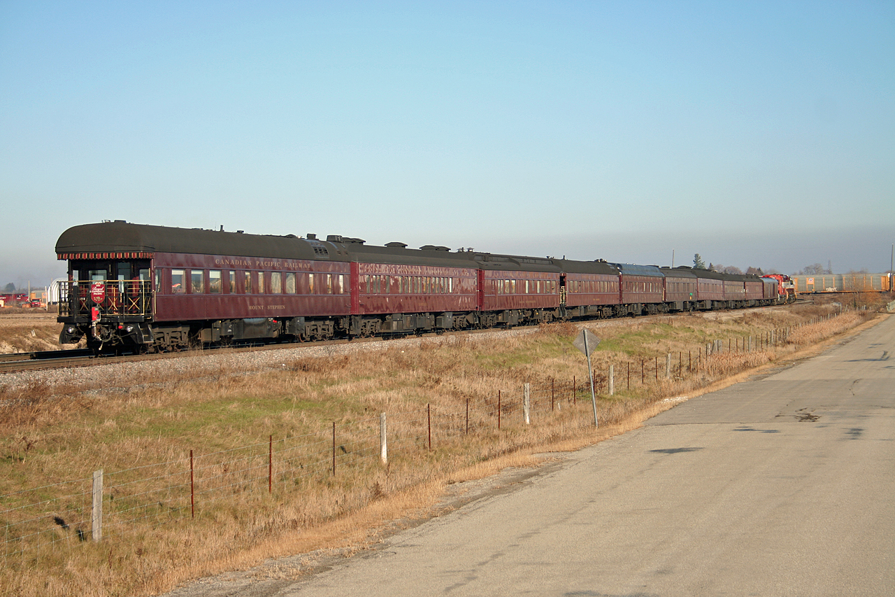 After touring the CP Intermodal Terminal at Vaughan, CP 40B awaits permission to enter the siding track at Elder as a northbound CP blasts by on the main line (power can be seen to the left)