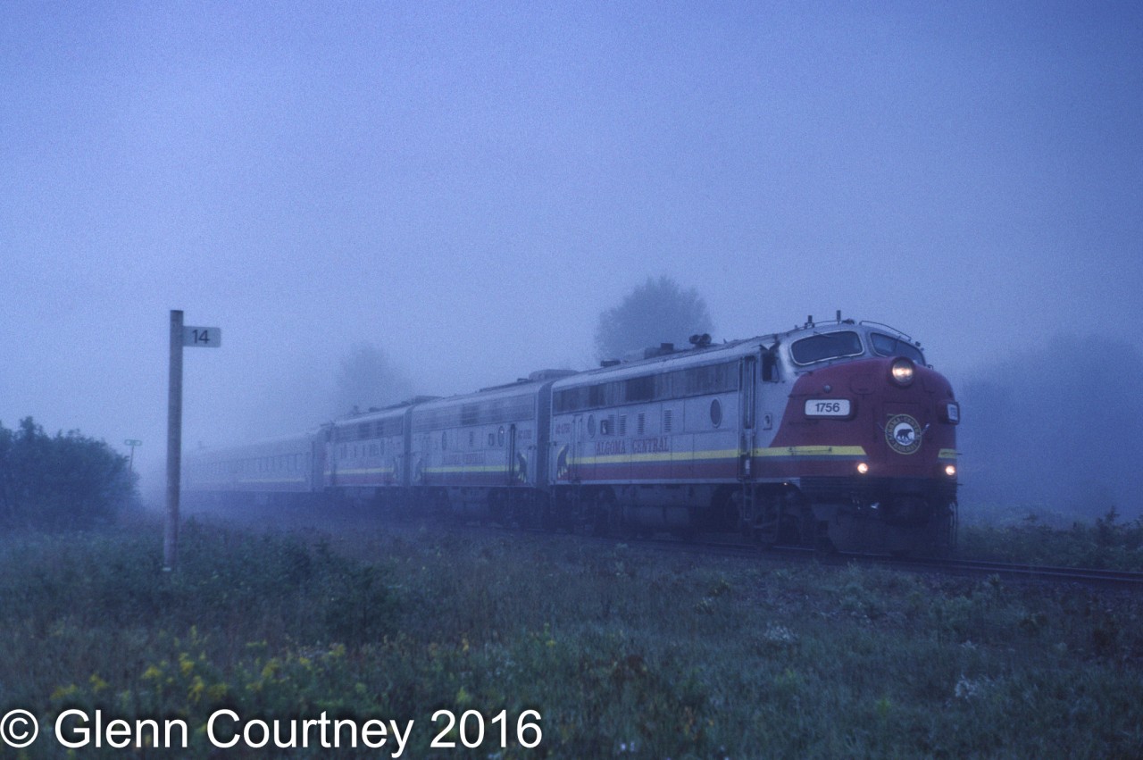 The early morning fog has not burned off yet as Algoma Central's Agawa Canyon Tour Train rolls through Heyden, 14 miles north of Sault Ste. Marie.