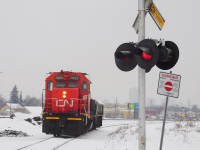 CN 7500 on Letellier Subdivision with crossing signal.
