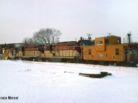 Plow Extra 74 with 401 and (CP) Angus-built caboose westbound through Brantford at Newport Street yard.
