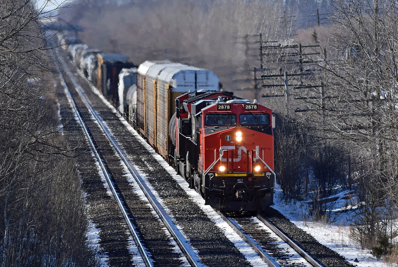 CN X332 approaches Denfield Road Bridge with CN ES44AC No. 2878 and CN ET44AC No. 3003.