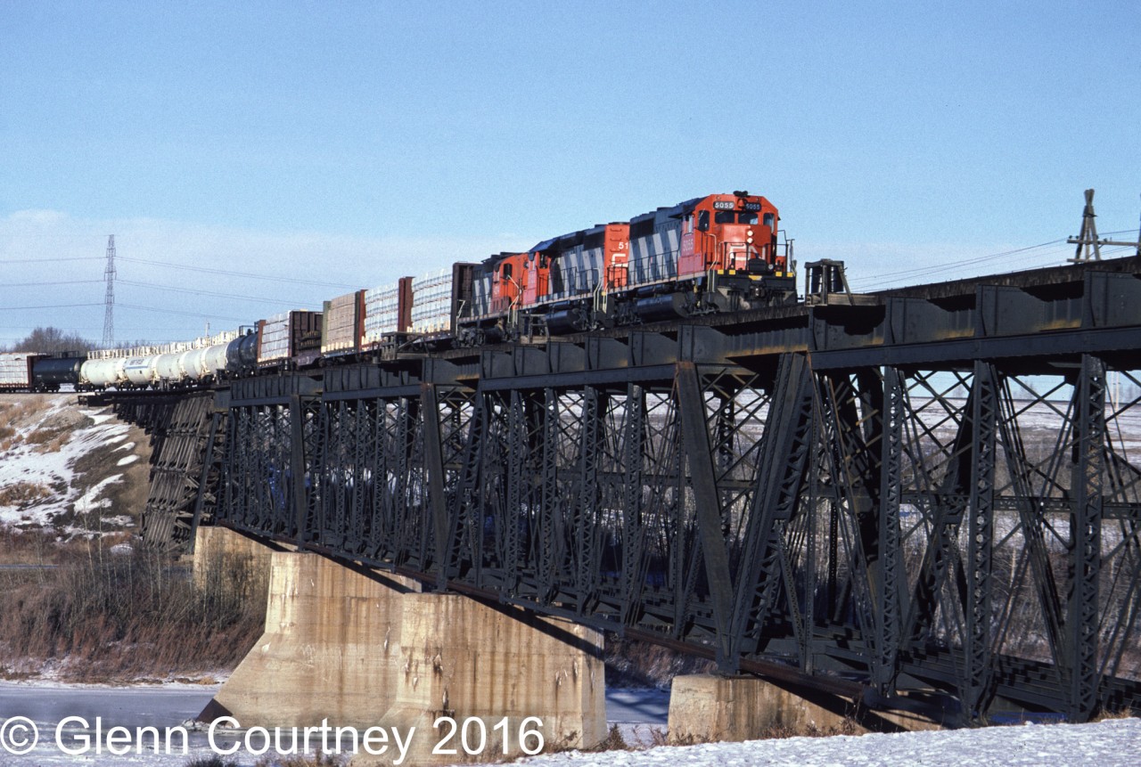 A clear blue dome of Arctic air is keeping it cold and clear over Alberta as CN 5055 heads east on the Prairie North Line. This bridge is gone now, CN built a new line bypassing Fort Saskatchewan and crossing the North Saskatchewan River on the east side of town.