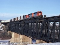A clear blue dome of Arctic air is keeping it cold and clear over Alberta as CN 5055 heads east on the Prairie North Line. This bridge is gone now, CN built a new line bypassing Fort Saskatchewan and crossing the North Saskatchewan River on the east side of town. 
