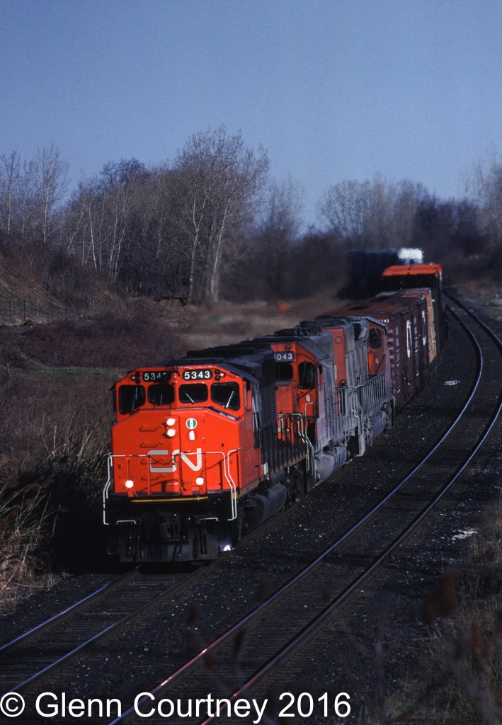 Freshly painted in the CN North America paint scheme CN SD40-2W 5343 leads Toronto - Fort Erie train #331 through Clifton.