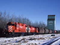 CP Rail's Buford Turn left CP's South Edmonton yard, headed south to Leduc and then went west on the Breton Sub. In this scene it is switching the Alberta Wheat Pool elevator in Buford. I was a little late to get GP9s on this job but a pair of new GP38-2s wasn't so bad. 

Of course the elevator is gone from Buford as is the Breton Sub. On the satellite map I cannot even tell where the elevator was located on this chilly day 29 years ago. 