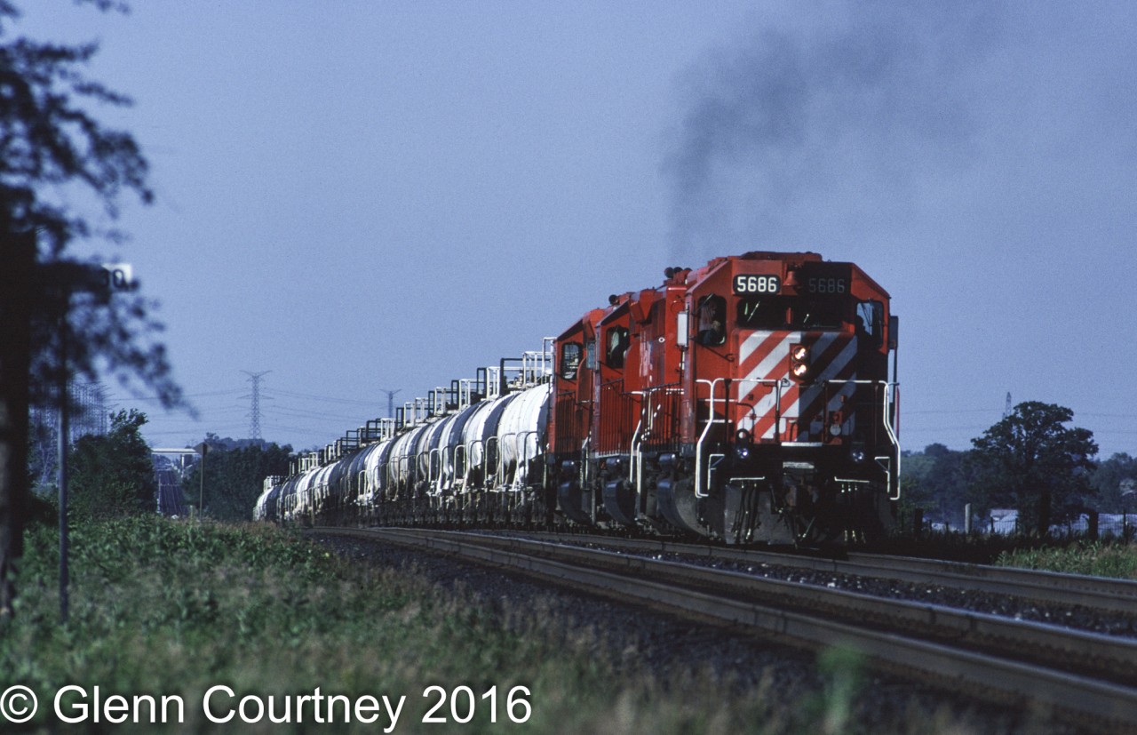 Back when the SD40-2 was king on CPR a trio of them lead by 5686 powers Second 507 out of the Hornby Dip with an acid train heading west on the Galt Sub.