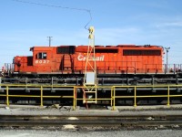SD40-2 was facing the wrong way for an eastbound train so it was brought to the turntable. Here it is having been spun around and backing off the table with the cab end facing eastward.