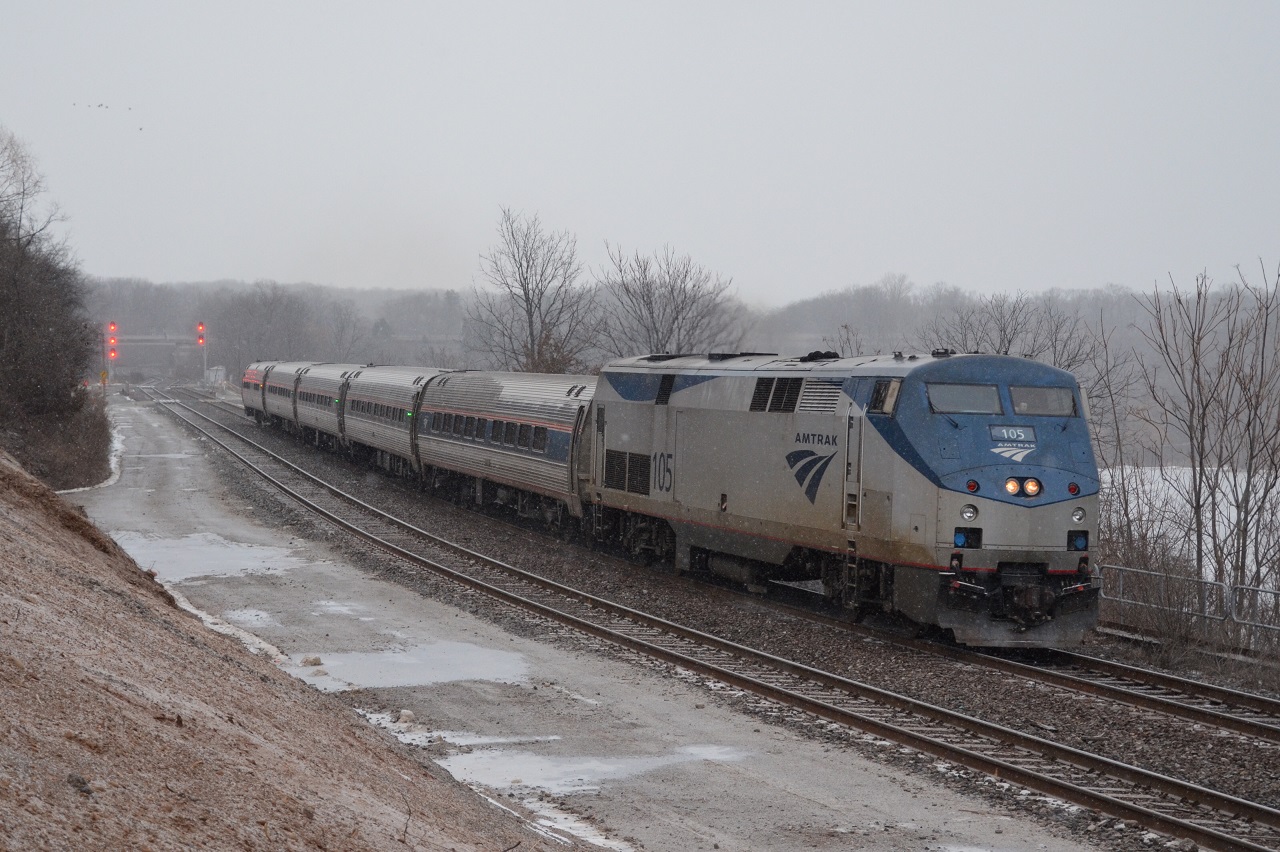 VIA 97 cuts through the snow after departing Aldershot station minutes ago. As VIA 97 passed, the tail end of CP 247 was to my right.