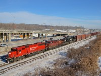<b>An NS runthrough train with CP and NS power, on CN tracks.</b> CN 529 is an NS runthrough train originating in Harrisburg as NS 31T. It becomes CP 931 while on CP tracks and then CN 529 while on CN tracks. It normally has mostly NS power, but there has been an increase in CP power on it recently. Here a clean ex-SOO SD60 leads a short CN 529 (20 cars) through Montreal. Lashup is CP 6251, CP 9700 & NS 2701.