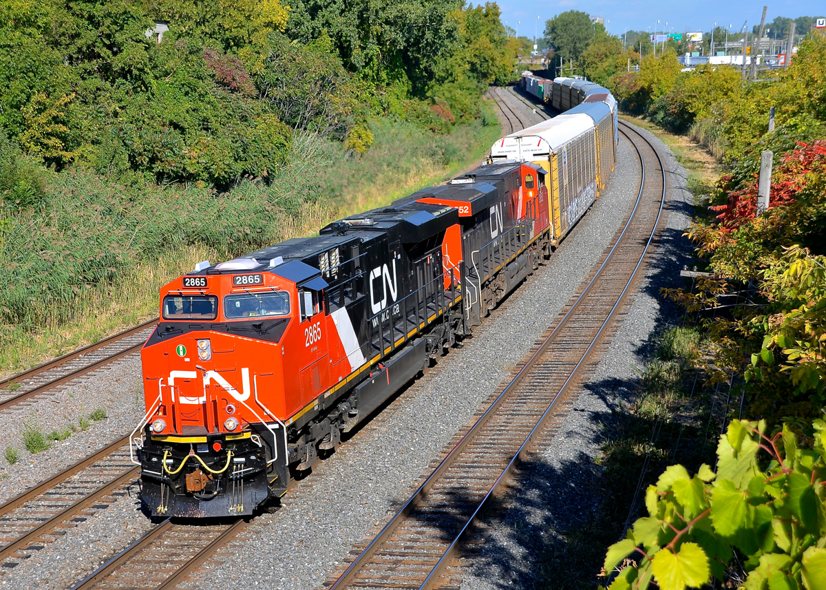 A novelty at the time. At the time this photo was taken in September 2014, CN's ES44AC's were rare in Quebec, whereas now many, many trains have them as power. They are also nowhere near as clean as they were soon after being built Here CN 401 heads west through Montreal West with two ES44AC's (CN 2865 & CN 2852), the former being brand new at the time.