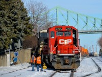 <b>CP and NS power in the Port of Montreal.</b> CP 142 with an unusual GP20C-ECO leader and two NS units trailing (CP 2205, NS 8362 & NS 2693) is light power in the Port of Montreal after dropping off its train. After the switch is thrown, the power will back light on its way back to St-Luc Yard.