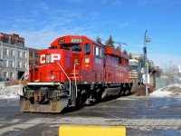 <b>Over the crossing before reversing.</b> CP 142 with an unusual GP20C-ECO leader and two NS units trailing (CP 2205, NS 8362 & NS 2693) is light power in the Port of Montreal after dropping off its train. Soon it will back light on its way back to St-Luc Yard.