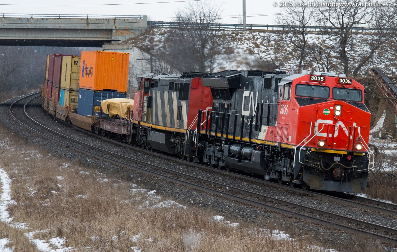 CN 148 leans into the curve at Garden Ave with CN 3035 and CN 2417 providing the power this morning. I was on my way to the Paris Train show and a timely heads up from Kyle and Cody while I was getting gas on Highway 2 gave me the time to get in position at Garden.