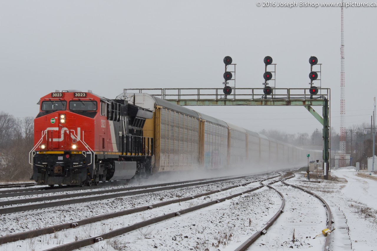 This photo is in response to Alex's photo of the train going through Hamilton.  Here we see E231 kicking up the fresh snow as it flies under the signals at Paris Junction.  CN is scheduled to be replacing the plant here and the future of the signal bridge is uncertain.  So get your shots now as who knows how long it will last...tracks panels are already in place, just a matter of time!