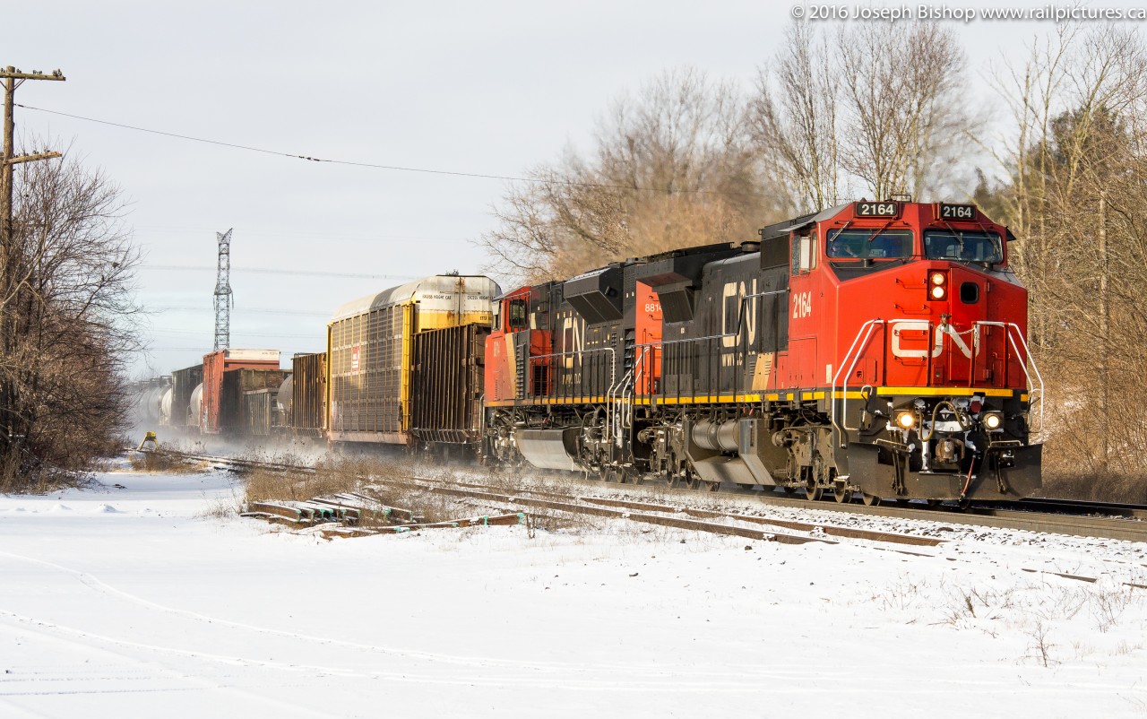 CN 384 cruises through Brantford with CN 2164 and CN 8814 on a bitter yet sunny January morning.  They had a crew change at Brantford before continuing East.