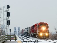 <b>A rare SD40-2 leader.</b> SD40-2 leaders have become very rare on CP in Montreal, but here CP 253 has SD40-2 CP 6017 leading. Trailing are two more EMD products, CP 5029 & CP 7307 as the train approaches Lasalle station after crossing the St-Lawrence river in light snow.