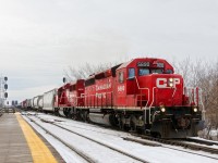 <b>1975 and 2014 vintage EMD's.</b> EMD products with build dates of 1975 and 2014 (SD40-2 CP 5690 & GP20C-ECO CP 2278) lead a long CP 253 (112 cars) through Lasalle Station with most of the train still over the St-Lawrence river and seaway. Of note is that 5690 was declared surplus in 2013 and 'unretired' in 2014. 