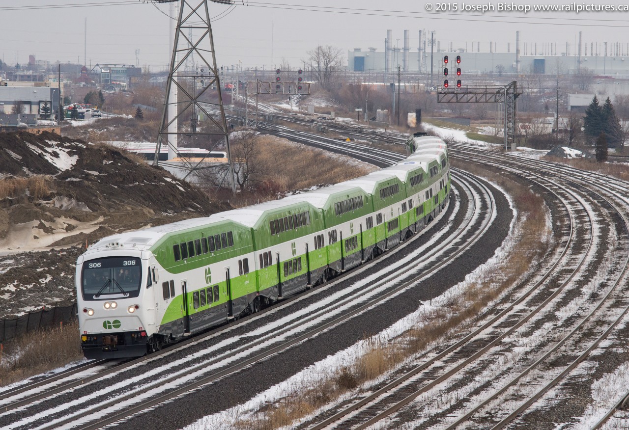GOT 306 one of GO's newest cab cars leads the way past Hopkins and towards their next station stop.