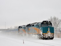 <b>100% Budd Ocean - head end.</b> VIA Rail ran extra sections of the Ocean this winter with 100% Budd consists, as it has done the last few winters. Here the last one of the 2015-2016 holiday season approaches its second to last stop at St-Lambert, with VIA 6424 & VIA 6457 as power and 14 Budd stainless steel cars in tow.