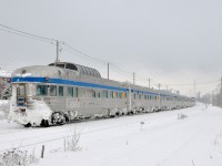 <b>100% Budd Ocean - tail end.</b> VIA Rail ran extra sections of the Ocean this winter with 100% Budd consists, as it has done the last few winters. Here the last one of the 2015-2016 holiday season approaches its second to last stop at St-Lambert, with Park Car <i>Evangeline Park</i> bringing up the rear; the last of 14 Budd stainless steel cars.