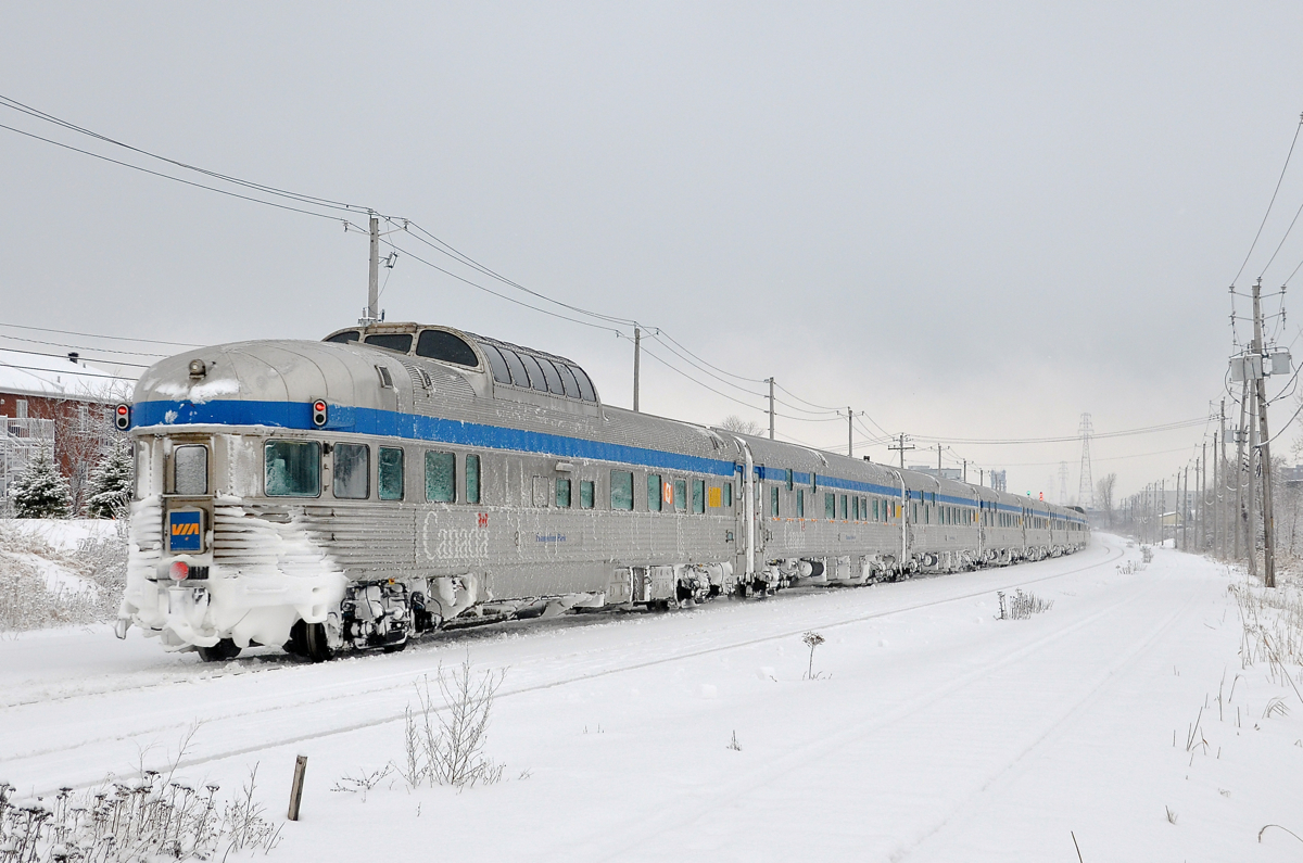 100% Budd Ocean - tail end. VIA Rail ran extra sections of the Ocean this winter with 100% Budd consists, as it has done the last few winters. Here the last one of the 2015-2016 holiday season approaches its second to last stop at St-Lambert, with Park Car Evangeline Park bringing up the rear; the last of 14 Budd stainless steel cars.