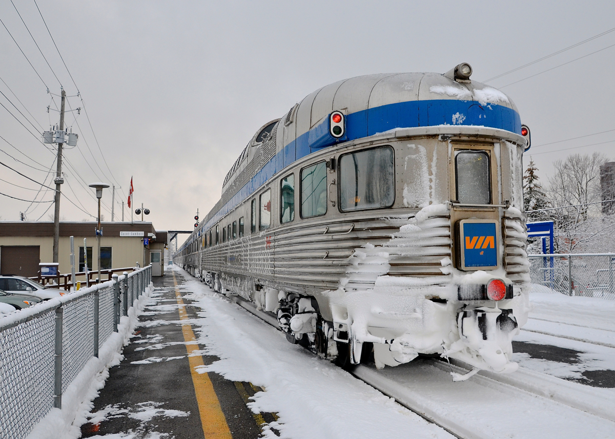 A snowy Park Car. Snow-covered Park Car Evangeline Park brings up the rear of VIA 15, stopped at St-Lambert Station, with 13 more Budd cars ahead. VIA Rail ran extra sections of the Ocean this winter with 100% Budd consists, as it has done the last few winters.