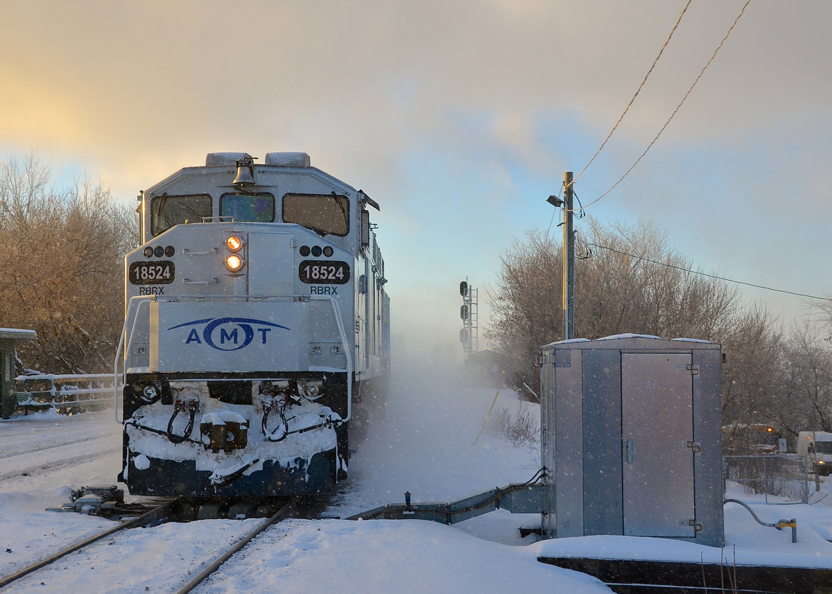 Crossing over in the snow. AMT 86 is crossing over to the west track at Lasalle station, very unusual as normally all AMT trains operate on the east track.