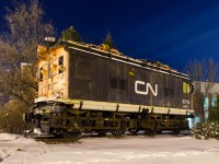 <b>A faded boxcab.</b> CN 6710 was built by General Electric and delivered to the Canadian Northern as CNoR 600 in 1919. It was used on the Deux-Montagnes electrified line (which terminates nearby) until being retired in 1995. Unfortunately it is starting to look worse for wear. Photographed on a winter night with a 15 second exposure.