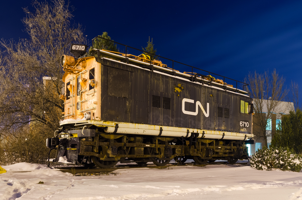 A faded boxcab. CN 6710 was built by General Electric and delivered to the Canadian Northern as CNoR 600 in 1919. It was used on the Deux-Montagnes electrified line (which terminates nearby) until being retired in 1995. Unfortunately it is starting to look worse for wear. Photographed on a winter night with a 15 second exposure.