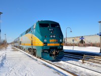 <b>VIA 60 and CP 119.</b> VIA 60 is arriving at Dorval a few minutes early with VIA 917 leading as CP 119 departs at right. 