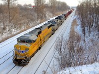 <b>A winged triclops in Montreal.</b> A rare for Montreal UP SD60M which has had the UP wings added to its nose (UP 2392, ex-UP 6237) is leading two NS Dash9's (NS 8978 & NS 8992) on CN 529 as it approaches its terminus of Taschereau Yard with just 23 cars in tow.