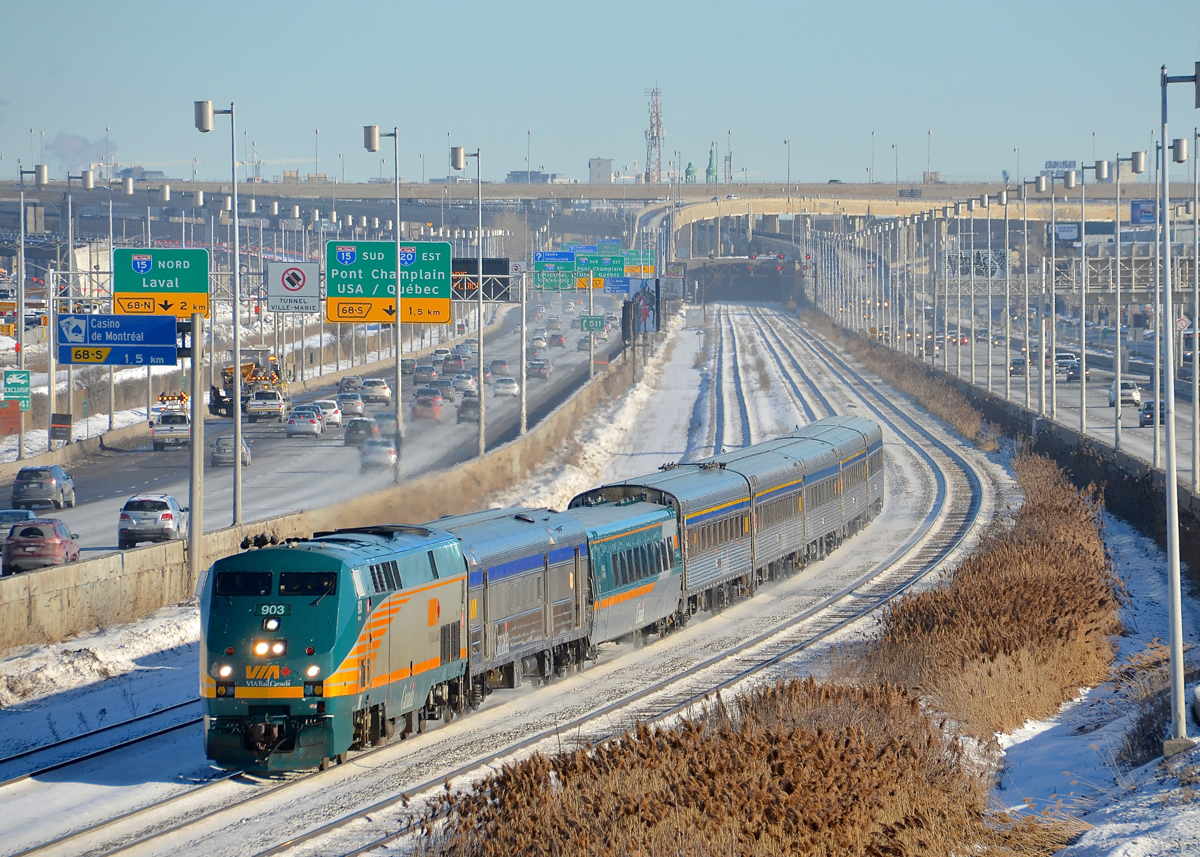 Not quite a matching consist. VIA 63 has a single LRC car marring a 100% stainless steel consist (the same consist it has had for months), as it heads west on CN's Montreal sub. At left and right is highway 20, which unusually runs with the eastbound lanes on the north side for a few miles here.