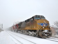<b>A filthy UP leader in the snow.</b> A filthy Union Pacific GEVO leads CP 551 through Lasalle station during a snowstorm. Lashup is UP 5432 & CP 8762.