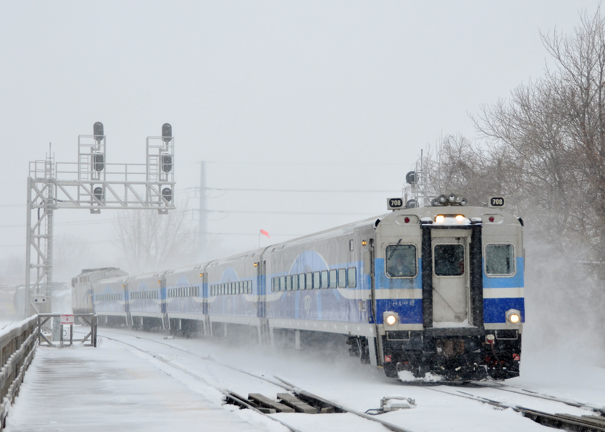 Approaching Lasalle station. AMT 73 is about to stop at Lasalle Station with cab car AMT 708 leading and AMT 1341 pushing during a snowstorm