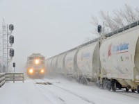<b>Two trains northbound over the St-Lawrence river.</b> Two trains are crossing CP's bridge over the St-Lawrence river as they enter the island of Montreal. AMT 74 at left is about to stop at Lasalle Station with AMT 1341 leading, while CP 253 at right is on its way to St-Luc yard.