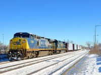 <b>Dash8 variety.</b> CN 327 is through Dorval with ex-Conrail Dash8-40CW CSXT 7384 in YN2 paint and recently repainted Dash8-40C CSXT 7589 as the lashup on another cold morning.